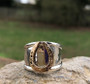 fun Hammered horseshoe ring in 14K gold and sterling silver. Price is based on a size 7 and will cost more to size. It is a very beautiful addition to your equestrian jewelry box and is very bold.