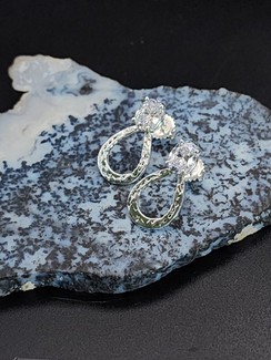 Sterling silver earring with cz or gemstone at the top of the shoe and cz in the nail holes. These can be customized in either silver or gold in any gemstone or colored cz. To customize call 8593330458