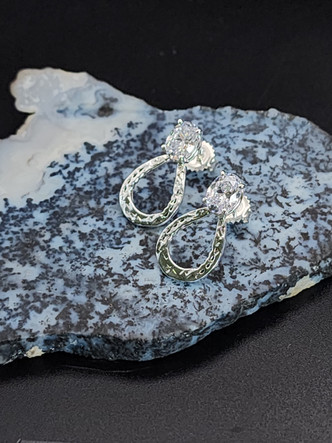 Sterling silver earring with cz or gemstone at the top of the shoe and cz in the nail holes. These can be customized in either silver or gold in any gemstone or colored cz. To customize call 8593330458