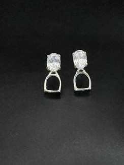 Small English stirrup earrings with posts in sterling silver. These earrings feature an 8x6 cubic zirconium gemstone.