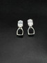Small English stirrup earrings with posts in sterling silver. These earrings feature an 8x6 cubic zirconium gemstone.