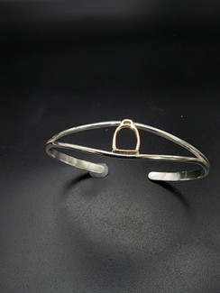 14k gold English stirrup on a sterling silver bracelet that is a small statement piece for your equestrian collection.