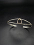 14k gold English stirrup on a sterling silver bracelet that is a small statement piece for your equestrian collection.