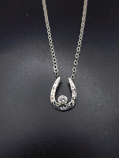 Sterling silver hammered show horseshoe necklace with cz. Comes with an 18-inch necklace please order what you need!!! Call 8593330458