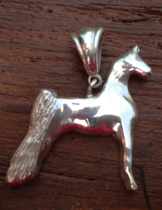 Full bodied show horse parked out pendant. The peacock of the horse show ring parked out and being judged on his perfect confirmation. He is standing and being judged. This is available in sterling silver and gold.