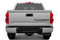 Rear tailgate of white Toyota Tundra truck showing matte black letter and text decals.