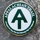 A.T. monogram pin ringed with "A footpath for those who seek fellowship with the wilderness."