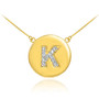 Letter "K" disc necklace with diamonds in 14k yellow gold.