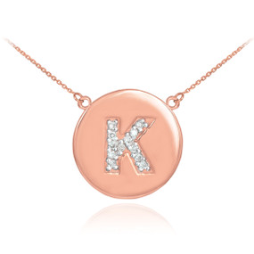 Letter "K" disc necklace with diamonds in 14k rose gold.