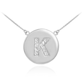 Letter "K" disc necklace with diamonds in 14k white gold.