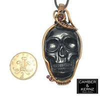 Size guide of Carved Black Agate pendant necklace with red Garnets next to UK 2 pence coin. Coin measures approx 25.9mm diameter