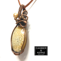 Front view of tiny flower heads in the Fossilized Coral pendant