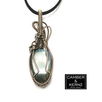 Back view of carved Labradorite skull pendant wrapped in oxidized Silver Plate wire
