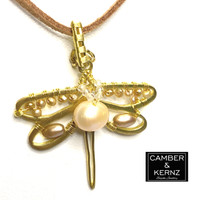 Front view of the golden dragonfly  pendant necklace encrusted with a mixture of different Pearls and sparkling faceted Topaz