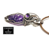 A0082 Side view Purple Amethyst Skull Pendant showing purple crystal incorporated into the design