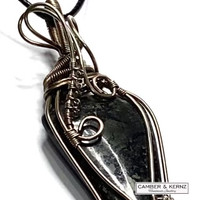 close up image of A0087 showing Silver Plate wire wrapped nuummite and vintage glass pendant