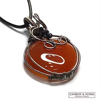 side view of A0090 carnelian wrapped in silver plated wire