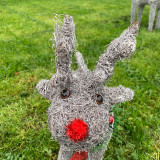 Frosted wicker reindeer planter with tinsel