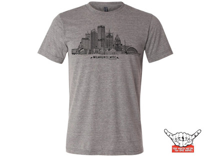 Rock over Milwaukee. Our ode to the city by the lake. Represent! Be proud. And don't wear other Milwaukee schlock. Buildings: US Bank, NML Tower, Mitchell Park Domes, 100 East Building, Art Museum, Eagles Ballroom and the Globe. Allen Bradley, Milwaukee Center, Gas Building, Miller Park, Bucks Arena, MECCA and 411 building. 4.3 oz., Organic cotton. 30 singles Low-impact yarn dyed.