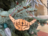 Trim your rock en roll Christmas Tree, with some Too Much Metal. Hand cut from Wisconsin sourwood, this ornament's bark is gray with a reddish tinge, deeply furrowed and scaly — just like a Randy Rhodes guitar solo. Finish size, 4" x 2"  