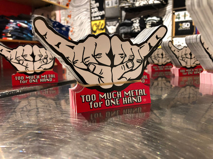 This is the big Too Much Metal sticker. Show your music love. Bust out the double Too Much Metal horns and salute the independent spirit of rock and roll . 100% Vinyl Outdoor Stock. Size 3" x 6"