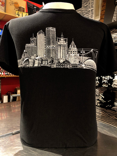 Black and White Milwaukee Skyline t-shirt featuring, US Bank, NM Tower, Fiserv Forum, UW-Milwaukee Panther Arena, Sydney HIH, Miller Park, Summerfest, Eagles Ballroom, Mitchel Park Domes, Milwaukee Art Museum, 100 East Building, Milwaukee Center, Gas Light Building, Quarels and Brady tower, Rockwell, Allen Bradley, Polish Moon, and Discovery World. 100% vintage soft cotton. 