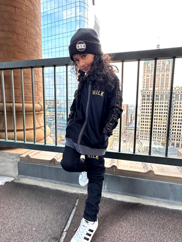 414 Black and Gold Track Womens. Gold embroidery. 414 arm length tape. Slim fit. Full zip with ribbed stand-up collar. 52% cotton, 48% recycled polyester doubleknit. Front zip pockets