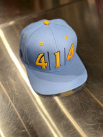 414 Cream City hat powder blue. For the love of the game. For the love of the city. This is how you really connect with the 414. Let us show you how it’s done.

Flat brim, snapback 100% brushed cotton hat. City skyline silhouette under the the brim of the hat. 