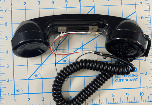 Black Push to Talk with Carbon (standard phone) mic. 4 wire cord, PTT switch in series with mic so it wires like a standard handset.