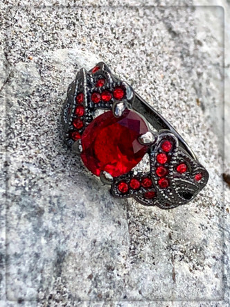 Stormy nights
This is a red ruby Garnet 18KT Black Gold Filled ring. If this just doesn't make you feel like a princess on a ship with Jack Sparrow! ( a.k.a. Johnny Depp wink wink)