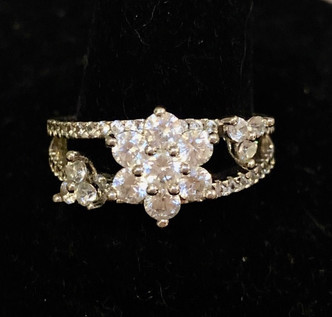 Size 6.5 Floral White Sapphire ring.  Delicate but very distinct .