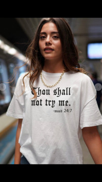 Thou Shall Not Try Me (Don't even think about it!) Our unisex everyday essential tee .keeps its shape and has under 5% shrinkage.     Features: Side-seamed.  Double-needle stitch at sleeve and bottom hem, shoulders and armhole. Shoulder taping.   Fabrication: 100% Combed ring-spun cotton.  Size guide scroll through-