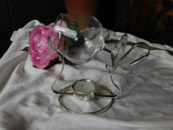 A CHARMING BRANDY GLASS ON A PLATED WARMER STAND