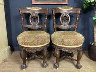 A FINE PAIR OF ANTIQUE CARVED OAK BURGOMASTER HALL CHAIRS