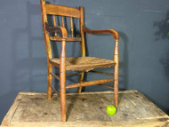 A CHARMING ANTIQUE COUNTRY MADE SPINDLE BACK LOW CHAIR