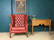 A FINE RED LEATHER COUNTRY HOUSE CHESTERFIELD ARMCHAIR