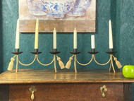 A CHARMING PAIR OF VINTAGE METAL CANDLE HOLDERS