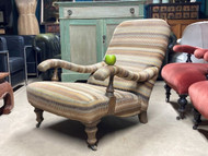 A FINE ANTIQUE ARMCHAIR IN THE HOWARD MANNER IN CONTEMPORARY FABRIC