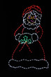 Red and white LED light display of Mrs. Claus outdoor decoration with a touch of green holly