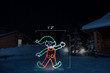 LED light animation of an elf wearing green and red doing a cartwheel with dimensions 1'2" by 4'3"