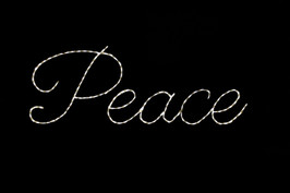White LED light display of the word peace