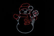 LED white snowman with a red hat, gloves and scarf holding a white and red peppermint candy