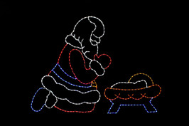 Red, white, blue and yellow LED Santa praying over a red, white, blue and yellow baby Jesus 