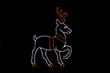 LED light display of a white reindeer with red and orange antlers facing right 