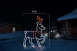 LED light display of a white reindeer with red and orange antlers facing right with dimensions 4'2" by 6'3"