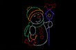 LED light display of a snowman with a green scarf and hat with yellow trim and mittens holding a blue bird house with a red bird perched atop the house and a red bird resting beside the snowman