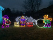 A yard showcasing vibrant Christmas light displays.