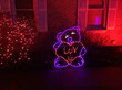 Valentine's bear light display in a yard.