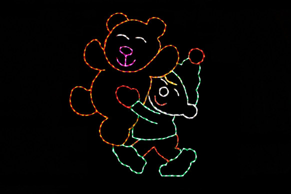 Light display of an elf holding a bear.
