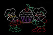 Two elves holding a cupcake outdoor Christmas decoration